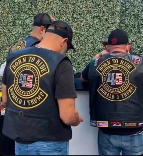 Group of men with a shirt saying "Born to ride" and "Donald J Trump"